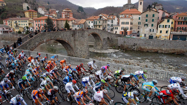 The peloton hums past the colour along the roads of the Milan-San Remo race (Reuters)