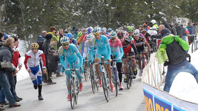 The Astana team of race Giro d'Italia winner Vincenzo Nibali leads the peloton through the snow of Stage 20 (Sirotti)