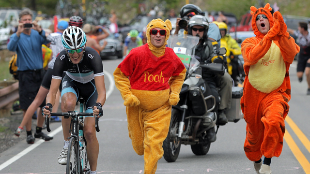 Andy Schleck is chased by Pooh and Tigger as he attacks on the climb of Swan Mountain during stage five of the 2011 USA Pro Cycling Challenge (Getty)