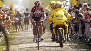 image Stuart O'Grady rides through the Forest of Arenberg on his way to a Paris-Roubaix title (Getty))