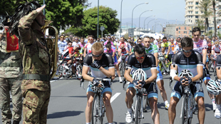 SOLEMN: With heads bowed, Leopard-Trek riders front the Stage 4 start in Quarto dei Mille. Photo: RCS SPORT