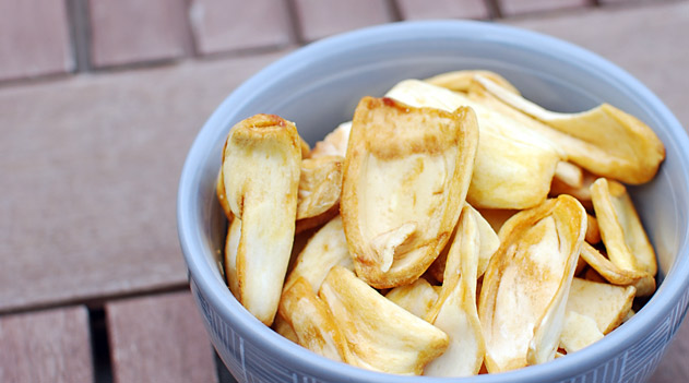 small bowl of jackfruit chips on a wooden table