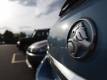 Holden to try to cut wages