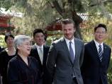 Beckham shines amid China gloom