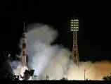 Soyuz capsule docks with space station
