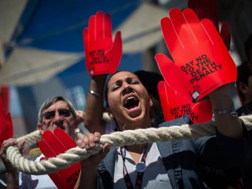 Demonstrators protest against the death penalty at the 5th World Congress against the Death Penalty in Madrid. (Getty)