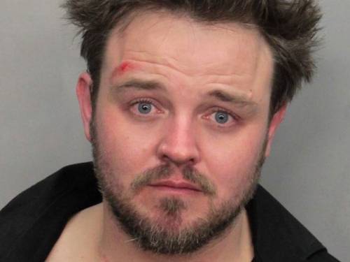 Matthew Newton as he appears in his police booking photo after being arrested in Miami. (AAP)
