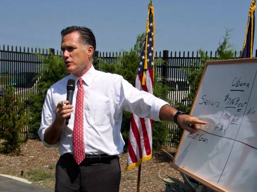 Republican presidential candidate, Mitt Romney points to a white board as he talks about Medicare during a news conference. (AAP)