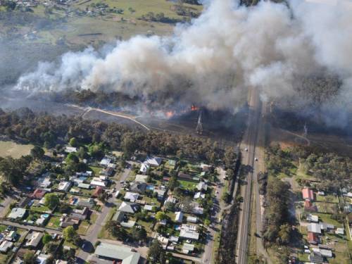 A major bushfire on the NSW Central Coast has been contained by firefighters. (AAP)