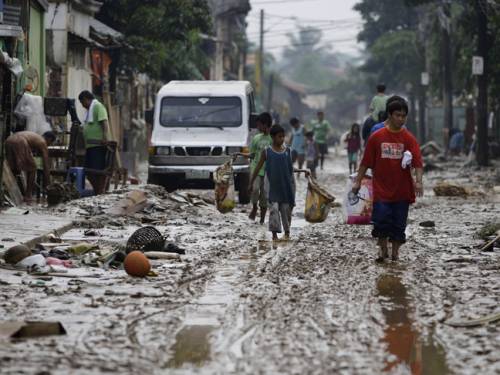 Vast areas of mainly rice-growing provinces to the north are still affected by recent floods that swept through the Philippines. (AAP)