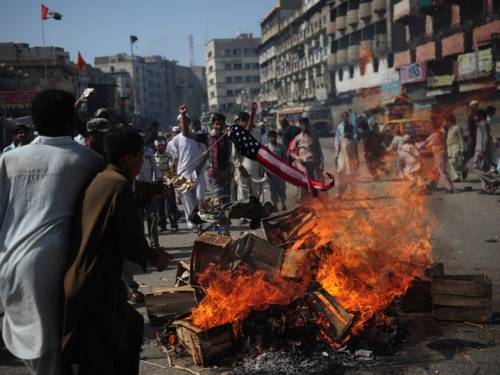 Pakistani Muslim demonstrators torch a US flag during a protest against an anti-Islam film in Karachi. (Getty)