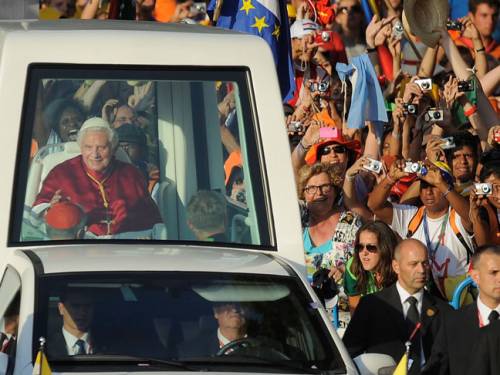 Pope Benedict XVI is welcomed by young pilgrims on arriving at Cibeles square during World Youth Day celebrations. (Getty)