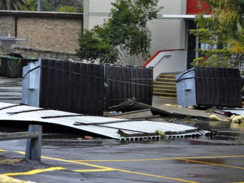Part of the roof is seen in the grounds of St Paul's Catholic College at Manly after wild winds hit Sydney. (AAP)
