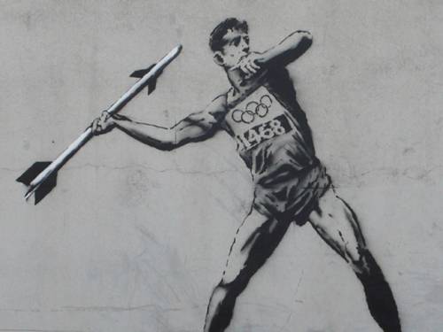The first Olympic-themed mural, called 'Going for Mould' shows a javelin thrower getting ready to throw a missile. (www.banksy.co.uk)
