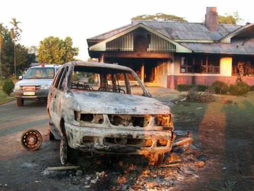 The burnt out wreckage of a vehicle at a tea plantation where workers torched the home of their boss, killing both him and his wife, following a labour dispute in the northeastern Indian state of Assam, officials said. (FILE:AAP)