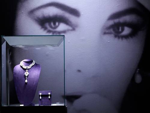 La Peregrina, a Natural Pearl, Diamond and Ruby necklace by Cartier, and a pair of Natural Pearl and Diamond ear pendants by Bulgari are on display during a preview of the full Collection of Elizabeth Taylor at Christie's in New York. (AAP)