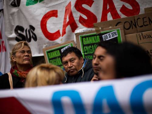 Demonstrators rally against government financial cuts. (AP Photo)