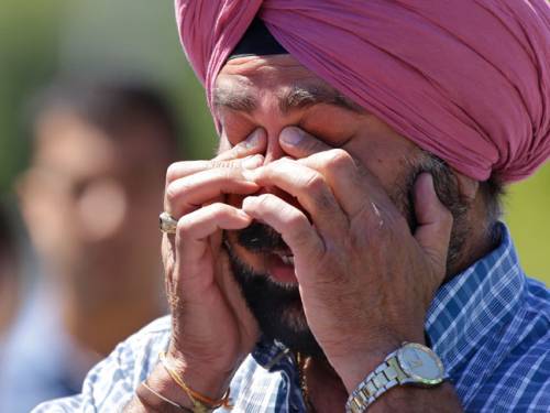A man reacts outside the Sikh Temple of Wisconsin. (AAP)