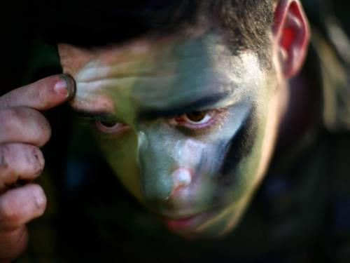 Smeared on the face and hands, the war paint allows the wearer to withstand temperatures of several hundred degrees centigrade for up to 15 seconds before suffering mild burns. (Getty Images)