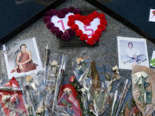 Tributes are laid down under the Flame of Freedom statue at the Pont de l'Alma underpass in Paris, where Lady Diana died. (Getty)