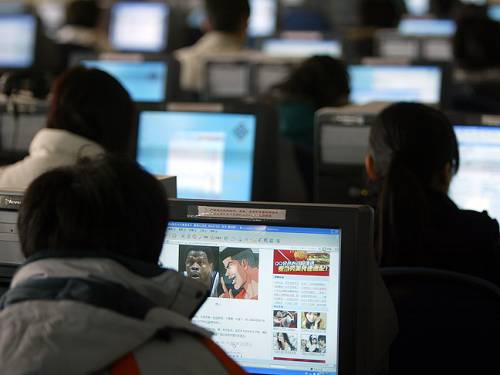 People surf the web in an Internet cafe in Shenyang in northeast China's Liaoning province. (AP)