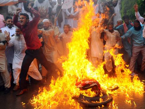 In Pakistan, thousands of students burned US flags and chanted anti-American slogans in the northwestern city of Peshawar. (Getty)
