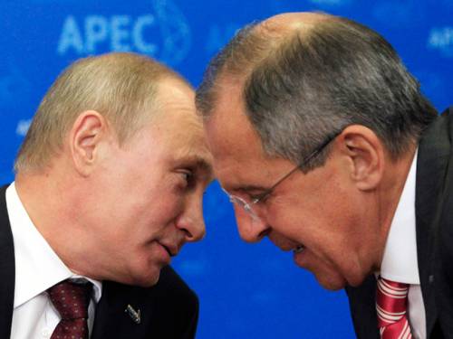 Russia's President Vladimir Putin and Russian Foreign Minister Sergei Lavrov chat before a meeting at the APEC summit. (AAP)