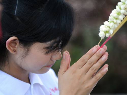 A Cambodian student prays during a memorial for Khmer Rouge victims in Phnom ... A Cambodian student prays during a memorial for Khmer Rouge victims in Phnom ...