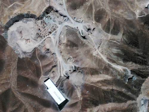 A file satellite image provided by GeoEye shows a facility under construction inside a mountain north northeast of Qom, Iran. (AAP)