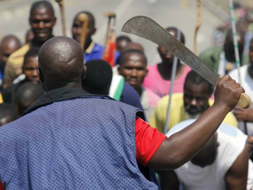 Thousands of miners protesting over pay have vowed to cripple South Africa's mining sector. (AAP)
