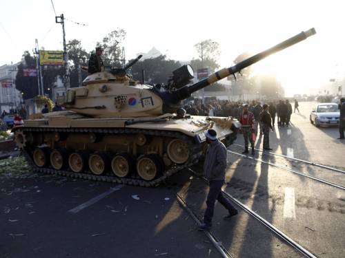 The Egyptian army has moved in to restore order after violent protests in Cairo escalated. (AAP)
