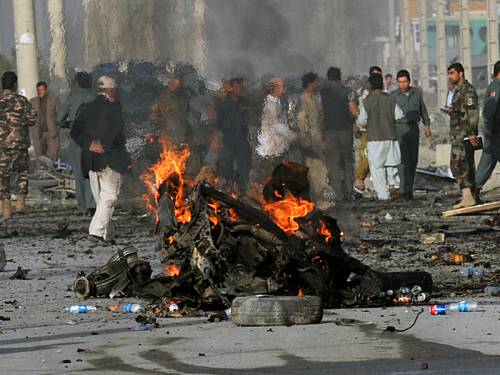 A female suicide car bomber has attacked a van in Kabul, killing 12 people. (AAP)