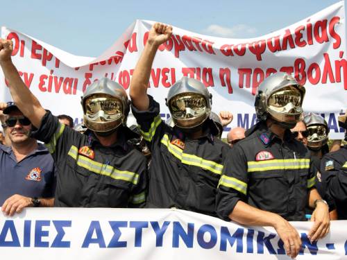 More than 12,000 protesters in Greece have marched against fresh austerity measures. (AAP)
