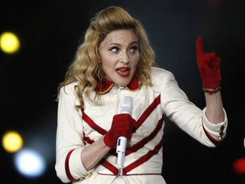 Russian activists are suing pop star Madonna for supporting gay rights at a show in St Petersburg. (AAP)
