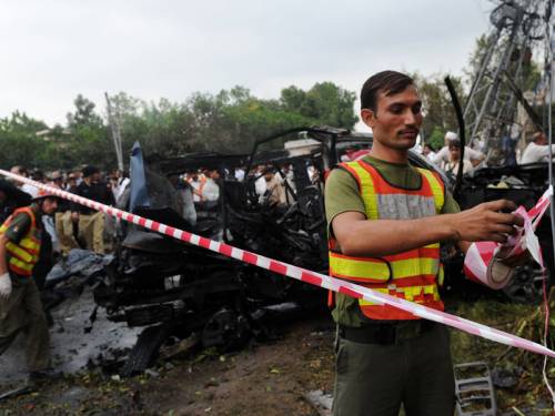 A US government vehicle was rammed by a suicide car bomber in northwestern Pakistan, killing two. (AAP)