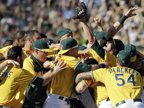The Oakland Athletics routed the Texas Rangers 12-5 to secure MLB's American League West title. (AAP)