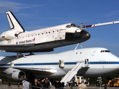 Bad weather is delaying the transfer of space shuttle Endeavour from Florida to California. (AAP)