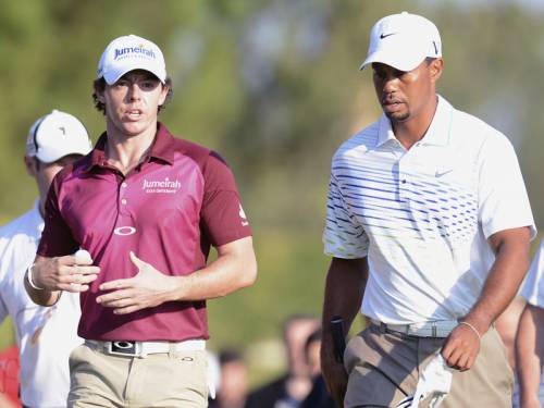 Rory McIlroy (L) and Tiger Woods will open their 2013 campaigns at the Abu Dhabi Golf Championship. (AAP)