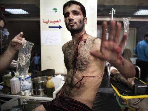Turkey's Anatolia news agency reported that the rebels tore down Assad's pictures to celebrate the capture but an opposition activist in Raqa said that fighting was still raging in the area as government troops attempted to recapture the crossing. (AAP)