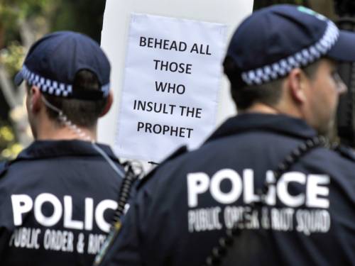 A 16-year-old boy has been arrested and charged with punching a police officer during a protest that turned violent in Sydney. (AAP)