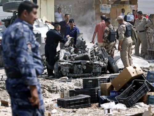 In Baghdad, a suicide bomber detonated an explosives-packed car in the central Karrada district, targeting the deputy head of police for the area, a police officer at the scene said. (File: AAP)