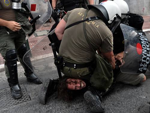 Police clashed with protesters on the streets of Athens during a visit by the German Chancellor. (AAP)