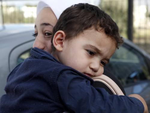 A two-year-old boy accidentally left behind in war torn Syria has been reunited with his family. (AAP)
