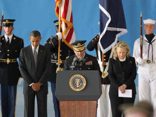 Barack Obama and Hillary Clinton have paid respects to those killed in the US consulate in Libya. (AAP)