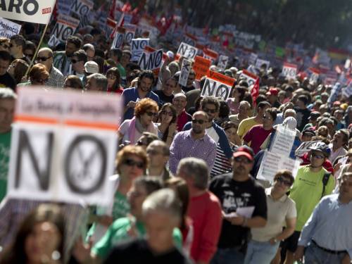 Tens of thousands of people have marched in Spain in protest of planned austerity measures. (AAP)