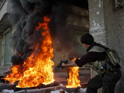 The leader of Syria's National Coalition is urging world powers to arm the rebels with weapons. (AAP)