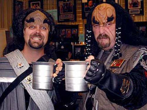 A photograph of two Star Trek fans, or 'trekkies', taken from startrek.com