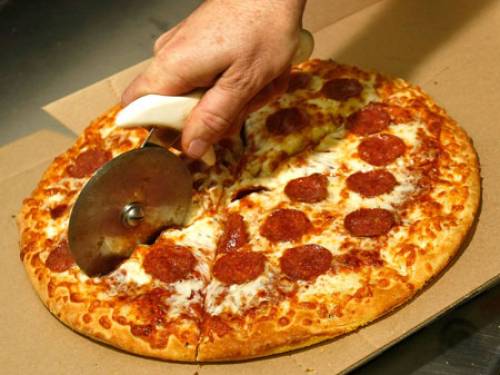 Mathematicians have worked out the best and fairest way to slice pizza (Getty Images)