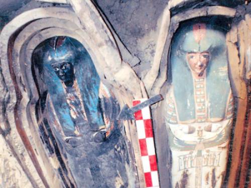An undated handout picture released by the Egyptian Supreme Council of Antiquities shows a wooden coffin containing linen-wrapped mummy covered in cartonnage (AAP)