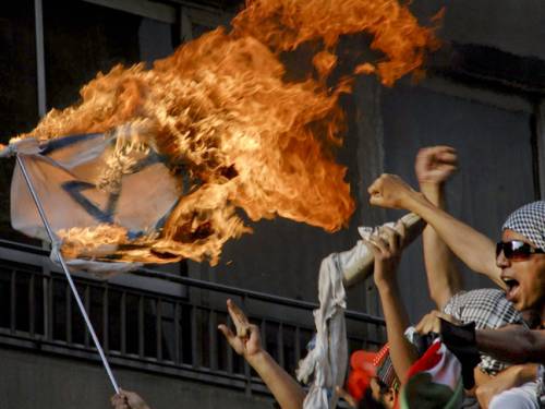 Last year, thousands of protesters tore down a security wall around a high-rise building housing the Israeli embassy in Cairo and then trashed its offices. (AP)